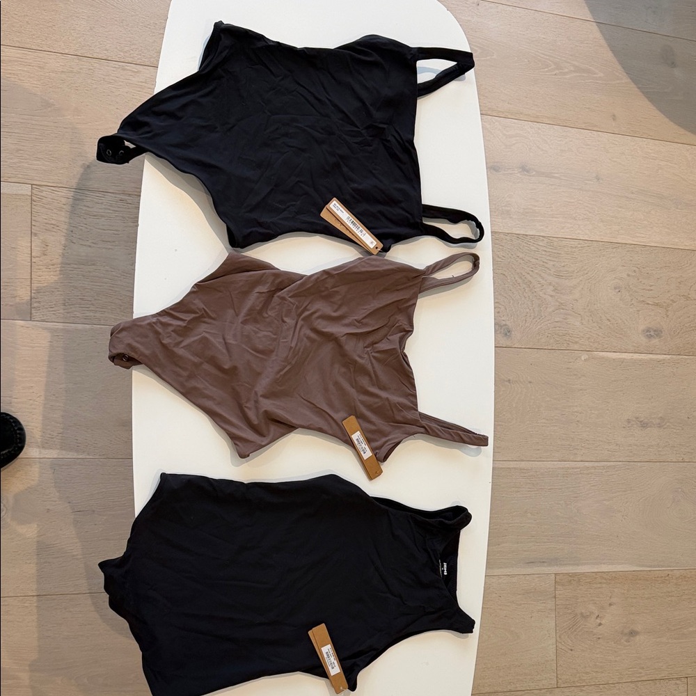 SKIMS Black and Brown Bodysuits
